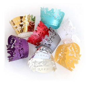 Laser cut It's a Boy cupcake wrappers in multiple colors for baby shower party decor