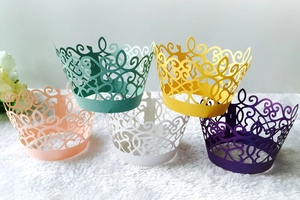 Detailed laser-cut cupcake wrappers with crown design in five elegant assorted colors