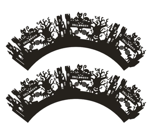 Detail of laser-cut black Halloween cupcake wrappers featuring spooky castles and pumpkins