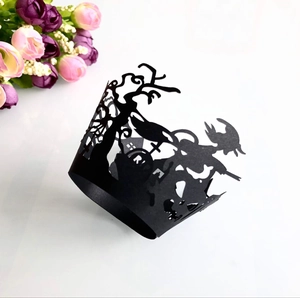 Laser cut Halloween cupcake wrapper with black hollow design featuring wizard and gravestone
