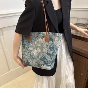 Boho floral tapestry tote bag with blue patterns and brown leather handles for women
