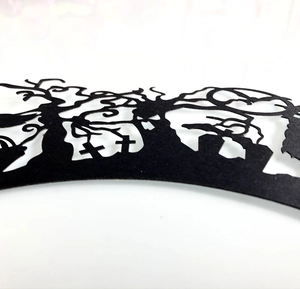 Detailed laser cut Halloween cupcake wrappers featuring spooky trees and tombstones