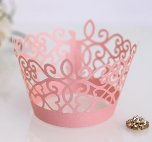 Pink laser-cut crown cupcake wrapper with lace floral pattern for party decoration