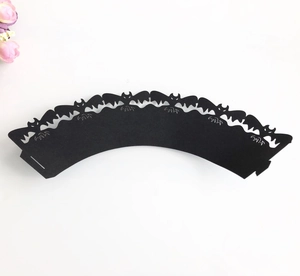 Laser-cut black Halloween cupcake wrappers featuring spooky bat silhouettes for party decor
