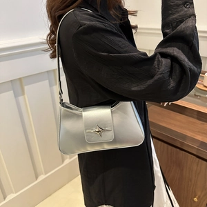 Silver metallic underarm bag with a star-shaped buckle for a chic minimalist look