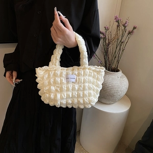 Chic cream bubble fabric tote bag with LOVE FASHION label for stylish summer commuting