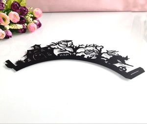 Detailed laser-cut Halloween cupcake wrapper with RIP tombstone and witch silhouettes