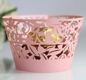 Pink laser cut flower cupcake wrapper with intricate hollow lace pattern for wedding party