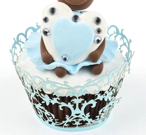 Sky blue laser-cut paper cake wrapper with elegant scroll lace pattern for cupcakes