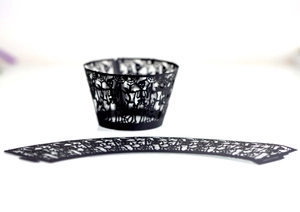 Flat lay and cylindrical view of black laser-cut spider web and skull cupcake wrappers