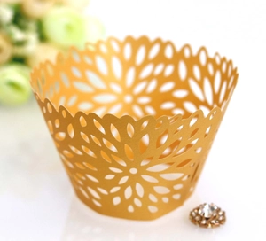 Laser cut gold pearl paper cupcake liners with elegant radial floral lace hollow design