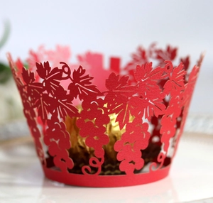 Red laser-cut vine design cupcake wrapper with vine leaf pattern for cake decoration