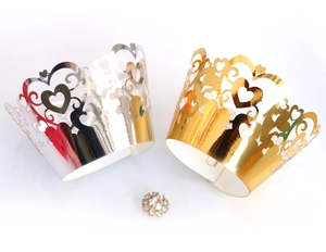 Detailed laser-cut heart pattern cupcake wrappers in gold and silver metallic finishes