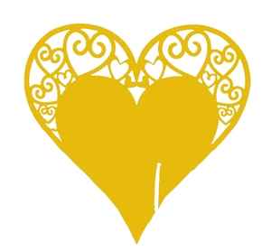 Detail of golden heart-shaped laser-cut wedding place card with intricate floral patterns