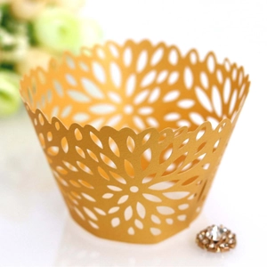 Golden laser-cut lace cupcake wrappers with elegant floral pattern for weddings