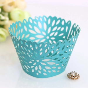 Mint green laser-cut floral cupcake wrapper in pearlescent paper for wedding decoration