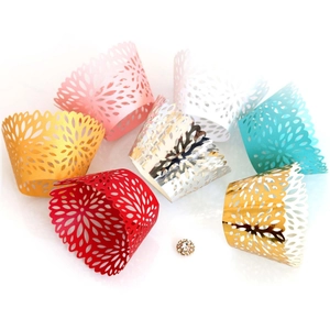 Laser cut lace cupcake wrappers in assorted colors with floral rhinestone accent