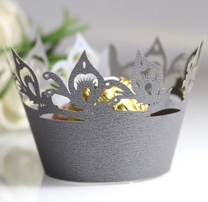 Elegant laser-cut dark grey paper cupcake wrappers with intricate crown hollow patterns