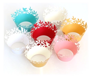 Laser cut cupcake liners with bird and leaf patterns in seven vibrant assorted colors