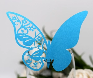Blue laser-cut butterfly place card for wine glasses featuring delicate hollow floral patterns