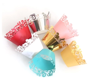 Colorful laser-cut cupcake wrappers with elegant lace pattern in metallic pearl finish