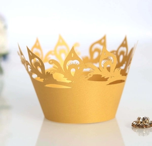 Golden crown laser-cut cupcake wrappers with elegant vine patterns for weddings