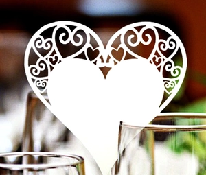 Laser cut heart shaped white paper card for wedding wine glass decoration and seating