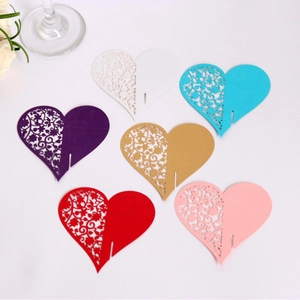 Laser-cut heart-shaped place cards in six colors with floral patterns for weddings