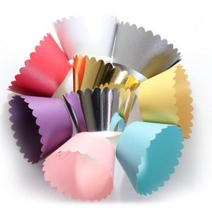 Colorful pearlescent cupcake wrappers with wavy edges in various vibrant shades