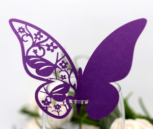 Laser-cut purple butterfly place cards for wine glass decoration at wedding parties