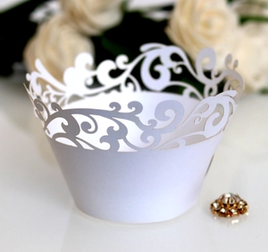 White laser-cut lace cupcake wrappers for weddings with elegant hollow floral pattern