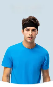Close-up of bright blue cotton crew neck T-shirt on male model with grey background