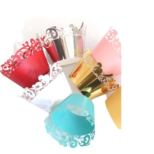 Lace hollow laser cut cupcake liners in gold white and pink colors for party decoration