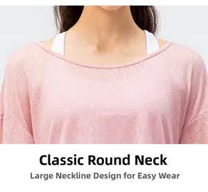 Detail of light pink yoga tee showing breathable texture and comfortable crew neckline