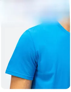 Close-up of precise stitching on the shoulder and sleeve of a blue cotton T-shirt