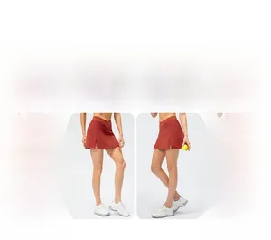 Detail view of brick red sports skirt with crossover waist and side split design