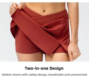 Detail of cross-waist rust red tennis skirt with built-in anti-chafing liner shorts