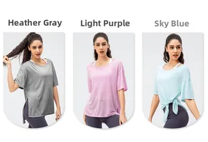 Detail view of side-slit loose yoga shirts in grey, purple, and blue moisture-wicking fabrics