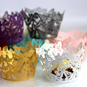 Laser-cut butterfly cupcake wrappers in multiple colors for elegant wedding party decoration