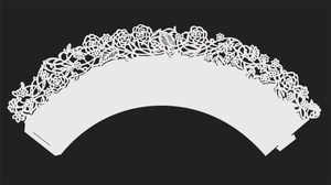 Close-up of laser-cut white cupcake wrapper with elegant rose pattern floral lace detail