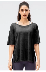 Detail view of charcoal gray breathable sports top with side slits and textured fabric