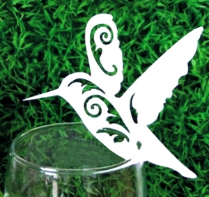 Laser cut white hummingbird wine glass place card with ornate floral镂空patterns