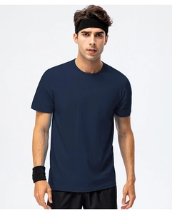 Detail of navy blue cotton crewneck T-shirt showing fabric texture on male model