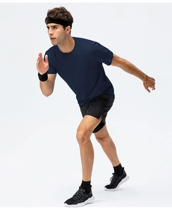 Detail view of a navy blue cotton sports T-shirt with matching black shorts and accessories