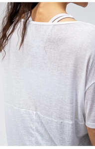 Close-up of white breathable fabric texture on lightweight summer sports yoga t-shirt