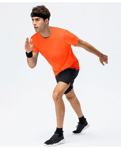 Close-up of bright orange quick-dry cotton T-shirt for men during outdoor sports running