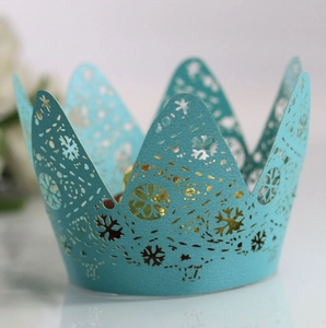 Sky blue laser-cut cupcake wrapper with crown and snowflake patterns for Christmas events
