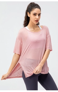 Detail of light pink breathable mesh sports top with high side slit for yoga and running