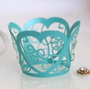 Teal laser-cut cupcake wrapper with heart hollow patterns for wedding cake decoration