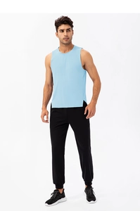Men's quick-dry fitness tank top and black pants set on a model in full body view